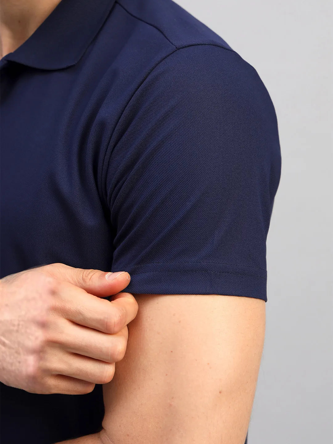 Sleeve of navy blue Polo tshirt